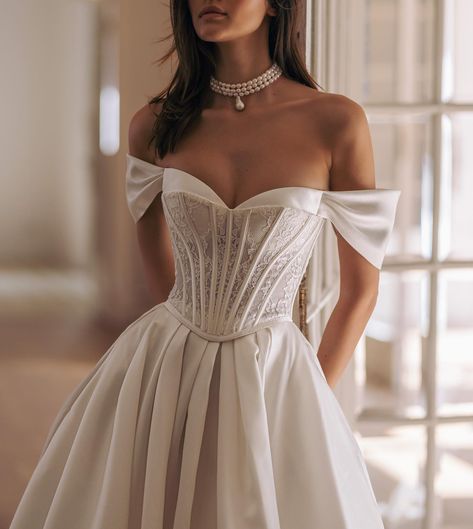 Discover the timeless elegance of corset wedding dresses. Perfectly designed to accentuate your silhouette, these gowns offer both support and style. From classic lace to modern designs, our collection features a variety of styles to suit your unique taste. Whether you envision a romantic fairy tale or a sleek contemporary look!🤍 GEMINI – JIMMY – TALI – TRUE – COLUMBIA – LEGEND – SABOTAGE – GENESIS Write your favorite dress in the comments!✍🏼 #WonaConcept #Wona #weddingdress #weddinggow... Corset Top Wedding Dress, Modern Elegant Wedding Dress, Bardot Wedding Dress, Corset Wedding Dresses, Wona Concept, Sleek Wedding Dress, Chic Bridal Gown, Corset Wedding Dress, Glam Wedding Dress