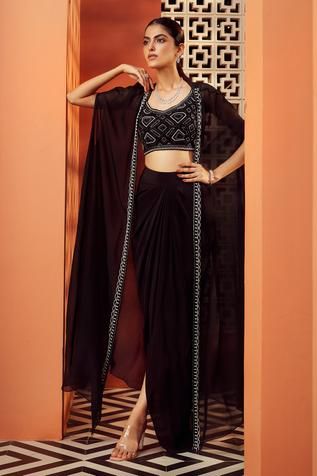 Shop for Niamh By Kriti Black Shantoon Embroidered Cape And Draped Skirt Set for Women Online at Aza Fashions Black Drape Skirt Outfit, Draped Skirt Set, Black Drape Dress, Black Outfits Indian, Cape Set Indian, Black Indian Outfits For Women, Black Cocktail Outfits For Women, Black Indowestern For Women, Draped Skirt Outfit
