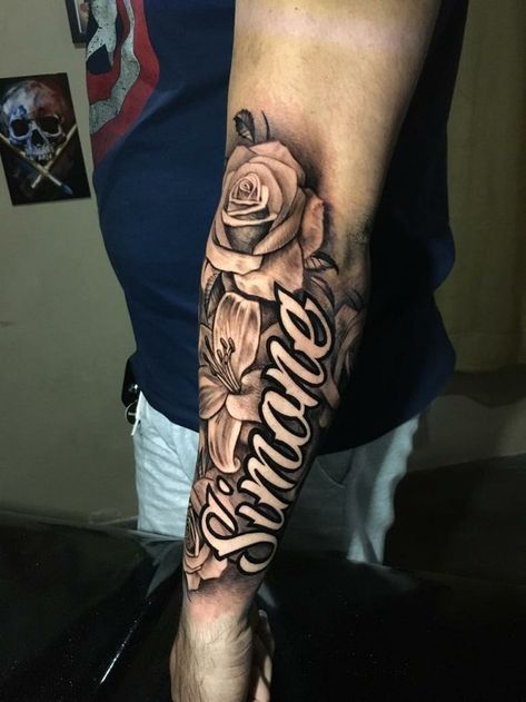 Tattoo Ideas For My Daughters Name, Mother Quote Tattoo Ideas, Bicep Name Tattoos For Women, Last Name Arm Tattoo, Bold Name Tattoos, Name With Roses Tattoo, Tattoo For Daughter For Men, Moms Name Tattoo Ideas Men, Child’s Name Tattoo Ideas