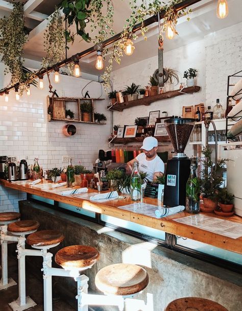 Coffee Shop Lighting Design, Small Brunch Restaurant Design, White And Wood Coffee Shop, Brunch Shop Design, Greenery Coffee Shop, Gray Restaurant Interior, Coffee Shop Shelving, Coffee Shop Accent Wall, Coffee Shop Shelves