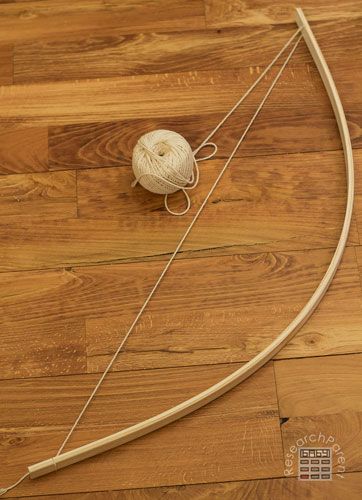 Homemade Bow and Arrows - ResearchParent.com Robin Hood Bow And Arrow Diy, How To Make A Cupid Bow And Arrow, Diy Bow And Arrow Cupid, Costume Bow And Arrow Diy, Making A Bow And Arrow, Diy Cupids Bow And Arrow, Cross Bow Diy, How To Make Bow And Arrow Diy, Diy Archery Bow