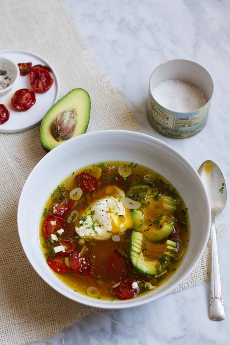 Brothy Garlic Soup with Slow-Roasted Tomatoes and Poached Eggs | http://saltandwind.com  | @saltandwind Poached Eggs, Healthy Soups, Egg Soup, Poached Egg Recipe, Breakfast Soup, Slow Roasted Tomatoes, Garlic Soup, Bowl Of Soup, Healthy Soup Recipes