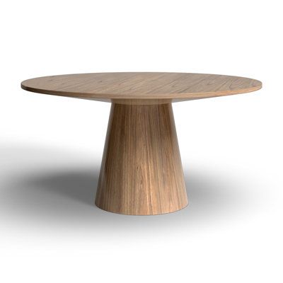 This round dining table invites people around it for casual dinners and get-togethers, and its eye-catching minimal silhouette brings mid-century modern style to your dining area or eat-in kitchen. Made from solid and engineered wood, it comes in a vintage black or natural finish for an understated look that blends in nicely with its surroundings. A pedestal base creates a conical shape that tapers up to the circular table top. With a 59" diameter, it can seat up to six people comfortably. Compa Round Dining Table Solid Wood, Wayfair Round Dining Table, Round Table 4 Chairs, Circle Table And Chairs, Round Wooden Dining Tables, Pendant Over Round Table, Round Dining Table Oak, Modern Circle Dining Table, Pedestal Table Entryway