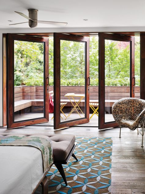 In Tia Cibani's master suite, the architect created a sizable terrace. The wood floors within the room run right out of doors, establishing a subtle sense of continuity. Thus, says Dubbeldam, “the balcony becomes part of the bedroom.” The coin chair is by Johnny Swing. The bed is from Design Within Reach. City Homes, Balcony Doors, Bedroom Balcony, Chelsea House, घर की सजावट, Trendy Bedroom, Balcony Design, The Loft, Remodel Bedroom