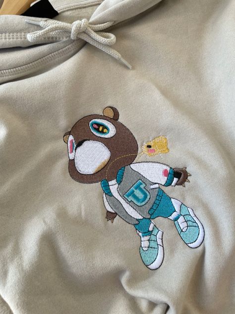 Kanye west 
Graduation 
Bear 
Hoodie Kayne West Graduation, Kanye West Bear, Kayne West, Graduation Bear, Stitch Hoodie, Vintage Crewneck Sweatshirt, Dragon Ball Super Artwork, Tshirt Printing Design, Embroidery Tshirt