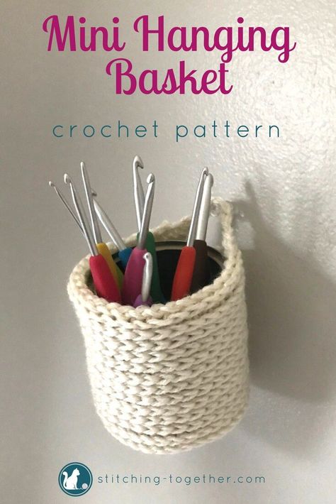 Adorable crochet mini hanging baskets you can make with this free crochet pattern. Perfect to hold crocht hooks, pen, brushes or fold it down to hold keys or tape! The mini baskets can be hung on the wall or placed on a desk. Imagine how cute they would look in your office! #crochet #crochetbasket #freepatterns #crochetpattern #crocheting #stitchingtog #freecrochetpattern #minibasket #diy Terico Basket, Office Crochet, Mini Baskets, Crochet Plant Hanger, Crochet Basket Pattern Free, Crochet Storage, Knit Basket, Crochet Plant, Adorable Crochet