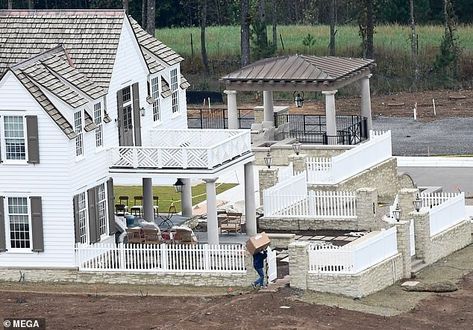 Carrie Underwood's new family mansion in Nashville pictured under construction Carrie Underwood, Carrie Underwood House, Family Mansion, Mike Fisher, Rocking Chairs, New Family, Growing Family, Move In, Porch Swing