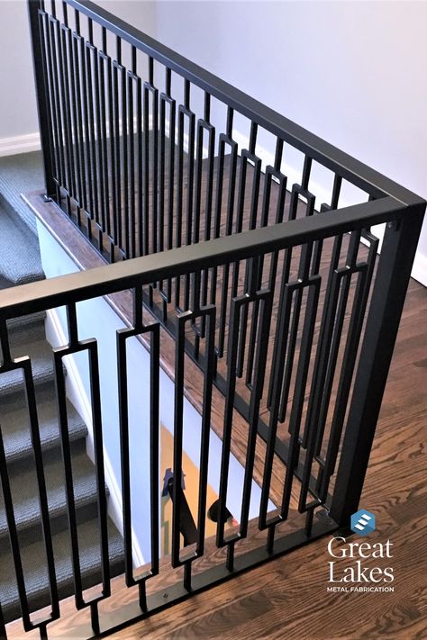 A modern rail design in a rectangle pattern is coated in oil-rubbed bronze in a newly renovated home. Balcony Railing Design Modern, Metal Staircase Railing, Iron Staircase Railing, Woods Home, Iron Balcony Railing, Metal Stair Railing, Steel Railing Design, Metal Fencing, Modern Stair Railing