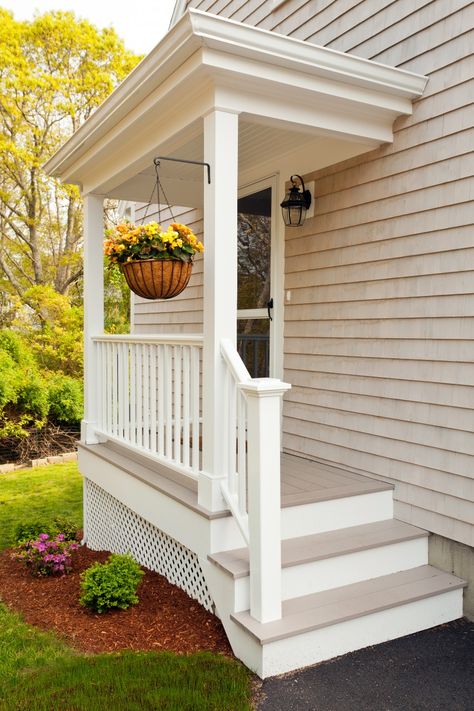 This home was initially a typical Cape Cod ranch; one level with a closed-off living room, kitchen and dining room, and three very small bedrooms. Patriot Builders began by razing the existing home almost completely, leaving only the foundation and one exterior wall in place. The remodeled home has an open living room/kitchen/dining room with … Cottage House Exterior, Farmhouse Porch Decor, Porch Remodel, Small Cottage Homes, Building A Porch, Farmhouse Porch, Side Porch, Porch Steps, Small Porches