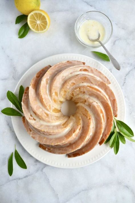 This bundt cake is the perfect sweet treat! Lemon ginger cake that is perfectly sweet with a slight zing of fresh ginger. Topped with lemon icing or vanilla whipped cream. Spring has totally sprung and the sun is coming out more. Thank goodness! That means summer is right around the corner. I am not usually one to wish time to pass, but being the first summer on the homestead I am so excited for it to be here.I have been spending a lot of time in the garden getting it ready to plant… Essen, Vodka Soaked Strawberries, Ginger Bundt Cake, Lemon Cream Cheese Frosting, Lemon Icing, Lemon Bundt Cake, Ginger Cake, Bundt Cake Pan, Vanilla Whipped Cream