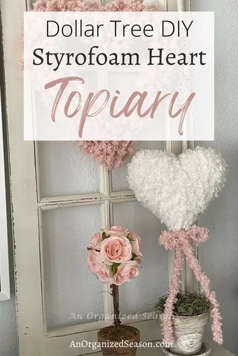 Do you love topiaries? I'm going to show you how to take a Dollar Tree styrofoam heart and turn it into a beautiful DIY topiary to decorate for Valentine's Day! Learn how to make a topiary using Teddy Bear yarn and a styrofoam heart. This is a simple DIY project so grab your glue gun and let's get started! Please pin this and follow us for more DIY and seasonal decor inspiration! Dollar Tree Puffy Styrofoam Heart, Valentines Decor Dollar Tree, Styrofoam Diy Ideas, Valentines Topiary Diy, Easy Valentine Centerpieces, Tin Hearts Diy, Diy Yarn Hearts, Heart Topiary Diy, Dollar Tree Topiary Diy