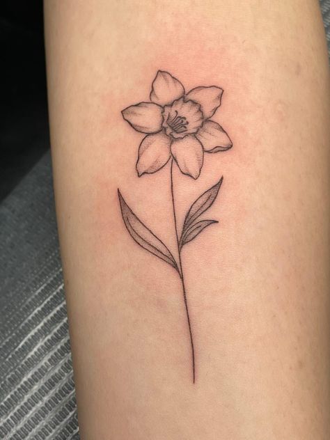 Tattoo ideas female Hand Tattoo | tattoo ideas by  Devon Ray Daffodil Name Stem Tattoo, Dainty Daffodil Tattoo With Name, Forearm Daffodil Tattoo, Small Tattoos Daffodil, Small Dafodill Tattoo, Lilly And Daffodil Tattoo, Daffodil Tattoo Forearm, Tattoo Ideas Female Daffodil, Daffodils Tattoo Small