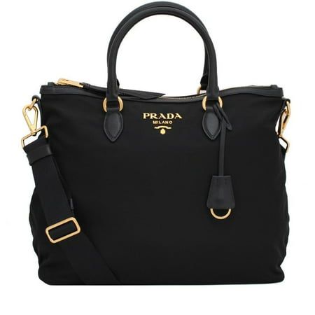 New Prada Black Tessuto Nylon Calf Leather Trim Satchel Tote Bag 1BC060 This Prada handbag is crafted with a mix of both nylon and leather in black. The nylon is smooth to the touch and makes the purse easy to care for. Along with this, the interior has two pockets to help you stay organized. On the front of the bag, the Prada Paris logo is confidently shown in gold-toned hardware. The bottom features gold bottom studs. This bag is so classy and elegant and goes great with everyday looks. Includ Prada Tessuto Nylon, Prada Tote Bag, Prada Handbag, Prada Tote, Satchel Tote Bag, Paris Logo, Crossbody Purses, Prada Nylon, Satchel Tote