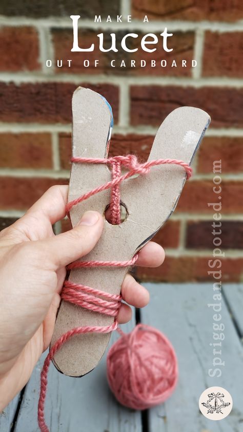 First person point of view of left hand holding two-tined lucet knitting tool made of cereal-box cardboard with partially completed cord wrapped around it. Tools For Knitting, Viking Accessories Diy, Viking Crafts For Kids, Lucet Projects, Viking Diy, Lucet Fork, Viking Weaving, Viking Knit Tutorial, Wild West Crafts