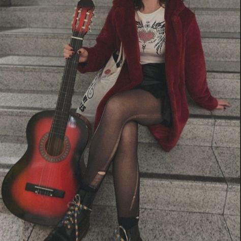 Girl sitting on stairs while holding a red guitar. She's waring a red fur coat with a black leather skirt and ripped tights. Garage Rock Aesthetic Outfits, Boho Rockstar Aesthetic, Red Rocker Aesthetic, Female Rockstar Aesthetic 70s, Rock Star Astethic, Rockstar Outfit For Women Aesthetic, Fem Rockstar Aesthetic, Rockstar Looks Women, Rockstar Boyfriend Aesthetic Outfit