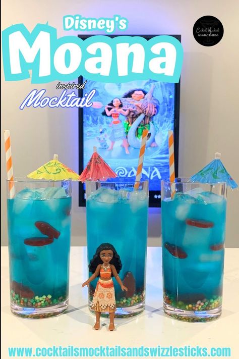 this image shows three blue drinks with nerds candy on the bottom, swedish fish thoughout, cocktail umbrellas and orange and white striped straws in front of a Moana movie poster with a Moana character in front of them. Disney Movie Night Snacks, Disney Themed Drinks, Disney Movie Themed Dinner, Family Movie Night Themes, Disney Movie Night Menu, Disney Themed Movie Night, Disney Movie Night Food, Girls Night Drinks, Disney Movie Night Dinner