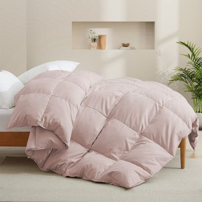 This 600-fill power all-season down comforter is wonderful. The fluff is exactly what you are looking for. slumber peacefully in the sublime softness of the all-season down comforter every night. Designed with a baffle-box construction to ensure uniform distribution of the duvet filling, which helps to avoid shifting or bunching. This all-season comforter is luxuriously soft and fluffy. Four corner tabs help anchor the duvet cover to the duvet insert effortlessly. With its double-needle stitchin White Down Comforter, Feather Comforter, Down Duvet, Down Comforters, White Goose, Goose Feathers, Bedding Basics, Down Comforter, Construction Design