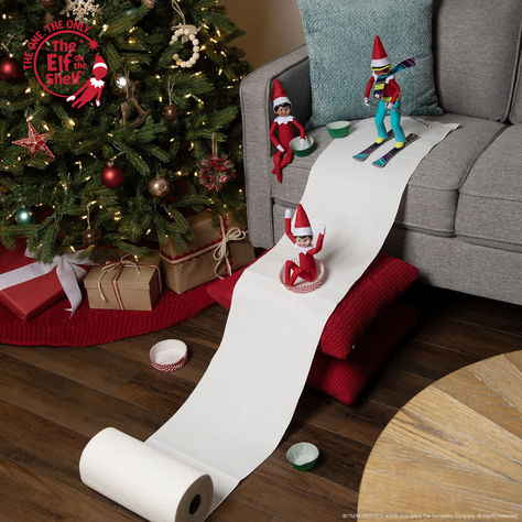 Watch as The Elf on the Shelf and their friends glide down a snowy hill made of paper towels. With sleds crafted from cupcake wrapping papers, they bring a touch of whimsy to your holiday decor. Easy Elf On The Shelf Leaving Ideas, Natal, Elf On The Shelf Ideas Little Kids, Elf On A Shelf Is Back Ideas, Buddy The Elf On The Shelf Ideas, Give To Receive Elf On The Shelf, Elf On The Shelf Boat Ideas, Elf On The Shelf Robe Ideas, Elf On The Shelf Ideas With Scooter