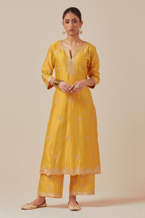 Yellow chanderi silk kurta with cutdana, bead, sequin embroidery in floral placement pattern and cutwork border. Paired with flared pant and border embroidered sheer dupatta. Components: 3 Pattern: Embroidery Type Of Work: Cutdana, bead, sequin Neckline: Notched Sleeve Type: Three quarter Fabric: Chanderi Silk, Tissue Organza Color: Yellow Other Details:  Attached lining Embroidery on pant hem Length:  Kurta: 47 inches Pant: 37 inches Model height: 6ft 7inches, wearing size S Approx. product wei Yellow Kurta, Silk Kurta, Indian Heritage, Kurta With Pants, Sequins Embroidery, Silk Embroidery, Kurta Designs, Kurta Set, Cut Work