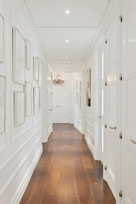 White hallway with molding - check out the ideas in this article for the 2nd floor hallway Narrow Hallway Lighting, Long Narrow Hallway Ideas, Long Narrow Hallway, Narrow Hallways, White Hallway, Narrow Hallway Ideas, Narrow Hallway Decorating, Upstairs Hallway, Hallway Wall