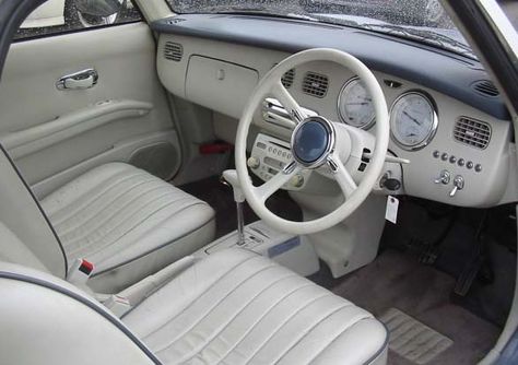 Interior of very cute Nissan Figaro. No snacks for the children in here! Miyagi, Concept Cars, Nissan Figaro Interior, Nissan Figaro, Japanese Market, Car Enthusiast, Mini Cars, Japanese Cars, Car Art