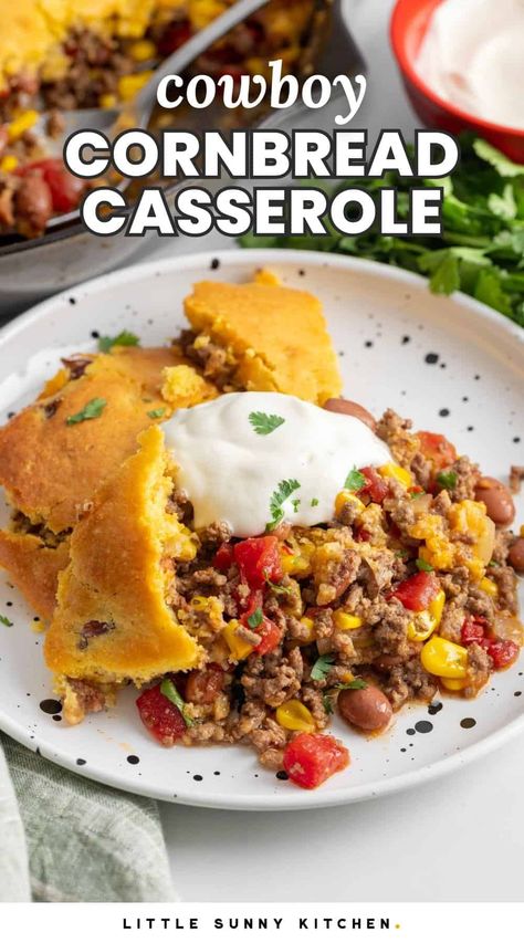 Cowboy Cornbread Casserole is a comforting, filling meal with ground beef and Tex Mex flavors, baked in a cast iron skillet for easy cleanup. Cast Iron Cowboy Casserole, Cowboy Skillet Casserole, Mexican Casserole Cornbread, Cowboy Cornbread Casserole Recipe, Ground Beef And Cornbread, Cornbread Casseroles, Meal With Ground Beef, Cornbread Taco Bake, Cowboy Cornbread Casserole