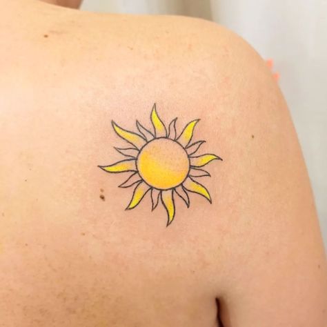 Sun Tattoo Ideas: 30+ Examples, Meaning & Top Designs Color Sun Tattoo Designs, Tattoos Of The Sun, Yellow Sun Tattoo Small, Be The Sunshine Tattoo, Sun Tattoo With Color, Sun Tattoo Black Women, Sun Tattoo Small Sunshine, Sun Tattoo On The Back, Small Sun Tattoo Ideas