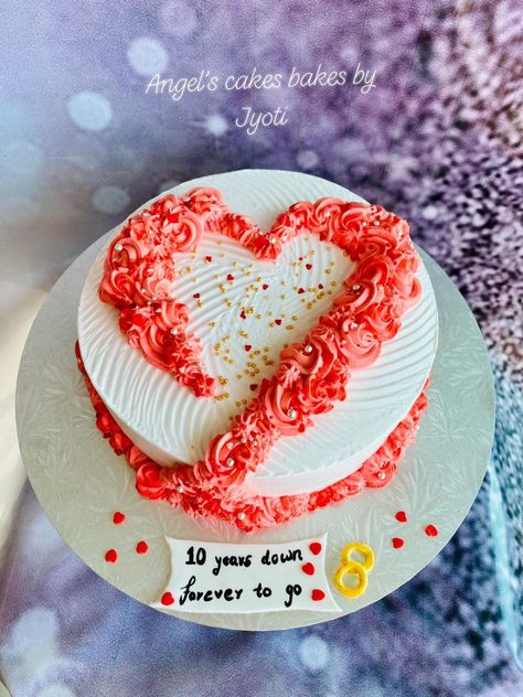 A simple and elegant 10th wedding anniversary cake with flowers in the shape of a heart 💑❤️🌸 Eggless orange fanta flavored cake layered with fresh cream frosting 🍊🎂😋 #Eggless #orangefantacake #freshcream #whippedcream #10thAnniversarycake #freshcream #AngelsCakesBakesbyJyoti Cake Designs For Anniversary Simple, Cakes For Wedding Anniversary, Heart Shaped Anniversary Cakes, 10 Year Anniversary Cake Ideas, 1st Wedding Anniversary Cake Ideas, Anniversary Simple Cake, Heart Shape Cake Designs For Anniversary, Cute Anniversary Cake Ideas Simple, Happy Anniversary Cake Design