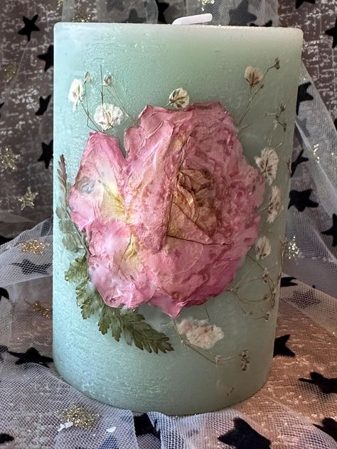 A romantic pink rose, delicate baby's breath and delicate ferns make up this candle.  The candle is delicately scented.  4 inches high  Comes gift wrapped in tissue and white box  Can be gift messaged I burn my candles and I have found them to be safe. Please follow instructions given on the Candle. To make your candles last well keep them away from strong light. Just like paintings fade with time and have to be protected from sunlight so do pressed flower candles. Candles are made when ordered.  https://mehreensmedley.etsy.com Pressed Flower Candles, Flower Candles, Green A, Flower Candle, Baby's Breath, White Box, Pressed Flower, Babys Breath, Pale Green