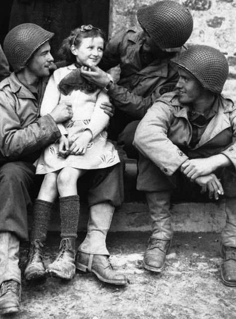 "A French girl finds three admirers from the ranks of American forces who have made a speedy and successful advance through Normandy, France on June 22, 1944. From left to right,Private Robert D. Furra, Private Willie Johnson and Private C.K. Jones." Herald Dispatch. Strange History, Cleopatra History, History Lettering, History Instagram, History Wallpaper, Fake History, History Drawings, History Tattoos, Egyptian History