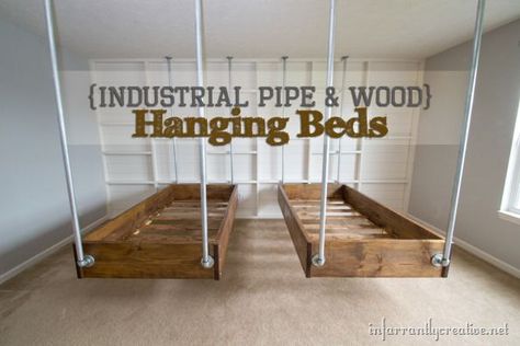 Wall behind bed. Bead board type with 2x4 "frameing over it. Gives look of bare wall but gives lots of small shelving spots. Hanging Beds, Hanging Bed, Pipe Furniture, Industrial Wood, Industrial Pipe, Style Deco, Boy's Bedroom, Book Shelf, Industrial Decor