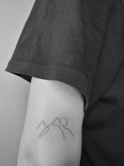 Small Tattoo Ideas Mountain, Small Tattoos Mountains Simple, Micro Tattoo Mountain, Mini Tattoos Mountain, Iceland Flower Tattoo, Wrap Around Mountain Tattoo, Mountain Tattoo Abstract, Mountain And Sun Tattoo Simple, Simple Ski Tattoo