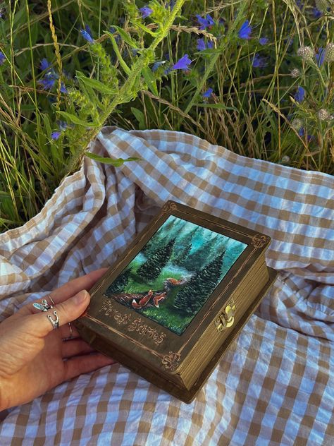 This wooden box is inspired by the forest I live nearby. The original wooden box in the shape of a book is totally hand-painted. A piece of the forest at your home - an enchanted forest landscape with three lovely foxes Wood Art Box, Painting On Wooden Box Ideas, Book Box Aesthetic, Painted Box Aesthetic, Wooden Book Box Painting Ideas, Wooden Book Box Ideas, Painting Boxes Ideas Aesthetic, Painting Boxes Wooden, Gift Box Drawing Art