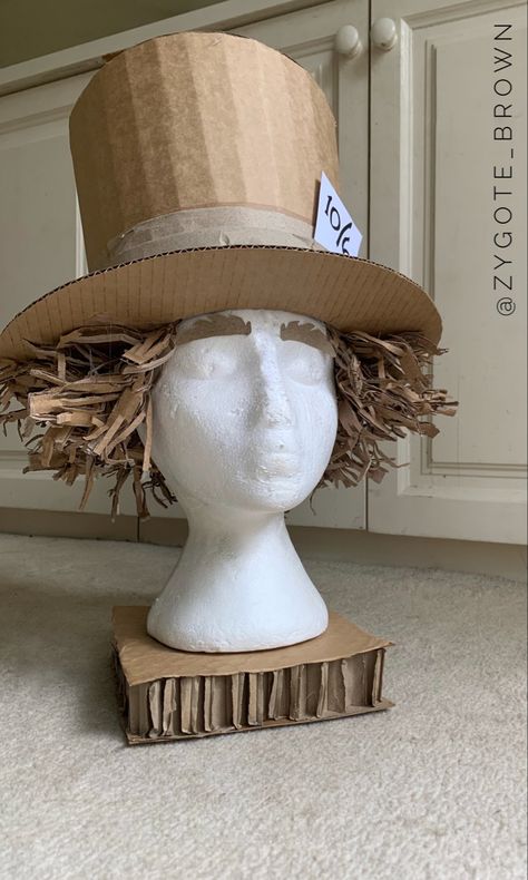 Mad Hatter hat made out of a cardboard box snd packaging. Cardboard Hat Template, How To Make A Top Hat Out Of Cardboard, Cardboard Mushroom Hat, Cardboard Top Hat, Diy Alice In Wonderland Costume, Top Hat Template, Cardboard Pumpkin, Cardboard Bunny, Hat Design Ideas