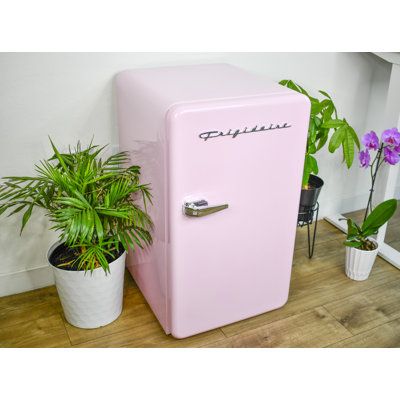 A refrigerator, also commonly known as a fridge, is a tall kitchen appliance that uses electricity to maintain a low temperature inside a compartment. This cold environment slows down the spoilage of food, keeping it fresh for longer periods. Fridges come in configurations, with features like adjustable shelves, crisper drawers, and ice dispensers. | FRIGIDAIRE Retro Compact Fridge w/ Chiller, 3.2 cu ft Compact Refrigerator for Office 34.5 x 20.0 x 22.0 in | FSAP1013_100663886 | Wayfair Canada Vintage Mini Fridge Retro, Mini Pink Fridge, Cute Mini Fridge In Bedroom, Aesthetic Mini Fridge, Office Mini Fridge, Fridge In Bedroom, Mini Fridge Pink, Frigidaire Mini Fridge, Period Drawer