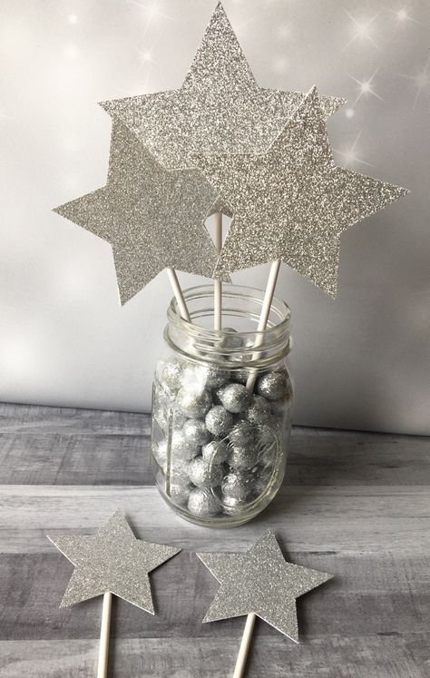 "Add some sparkle to your party centerpieces with these glitter star centerpiece picks. These star wands go perfectly with a Twinkle Twinkle Little Star shower or birthday party as well as anniversaries, birthdays, graduations or any party theme!! Each set of star picks comes with 5 stars in 3 different sizes! The large star is 5\", there are two medium sized stars which are 4\" and two small stars which are 3\". All stars are attached to a wooden skewer making it easy to stick them into flower Moon Stars Centerpieces, Under The Stars Table Centerpieces, Moon And Stars Centerpiece Ideas, Space Theme Centerpiece, Space Centerpiece Ideas, Moon Centerpiece Ideas, Glitter Themed Party, Star Theme Party, Glitter Party Decorations