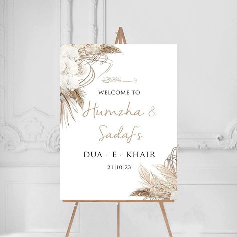 Dried Floral Pampas 'Dua E Khair'  Welcome Sign Personalised entrance welcome sign. Suitable for a frame or can be backed onto foam backing board before being despatched. Please select your size and send over your personalisation- names in order and date. Please do not hesitate to get in touch with any questions or extra personal touches you may require :) GOLD IS GOLD COLOURING ONLY All our prints are printed on high quality matt paper 280gsm A5-A3, 180gsm A2 *Easel, Flowers, Props etc are not included - you are purchasing the print only* POSTER - Professionally printed onto high quality white 260gsm satin poster paper. This is ideal for displaying in a frame or mounting on your own board. Will be sent rolled up in a tube. FOAMBOARD - Print mounted onto a 5mm foamboard, lightweight but st Welcome Wedding Signs Entrance, Dua Khair Decoration At Home, Engagement Welcome Board, Dua E Khair, Shaadi Ideas, Engagement Party Welcome Sign, Bride Shoot, Engagement Decor, Board Party