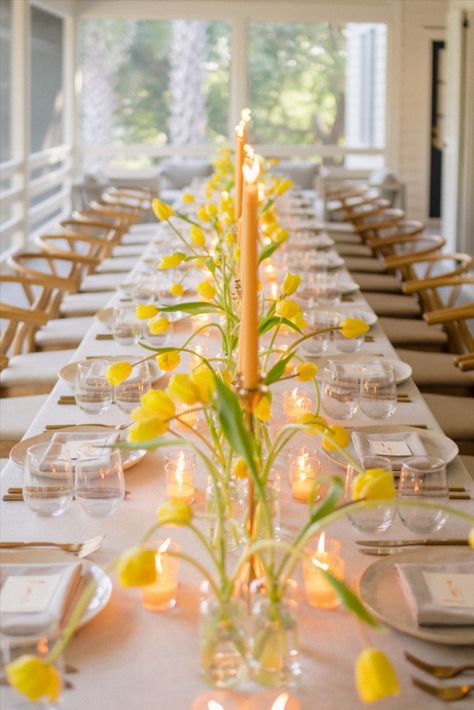 This beautiful porch dinner party is the epitome of spring! Bright tulips and votive candles paired with neutral china placed on top of a simple linen created the perfect spring dinner party decor. Tulip Theme Party, Porch Dinner Party, Tulip Table Decor, Spring Event Ideas, Spring Engagement Party, Spring Fling Party, Dinner Party Centerpieces, Tulip Centerpiece, Easter Porch Decor