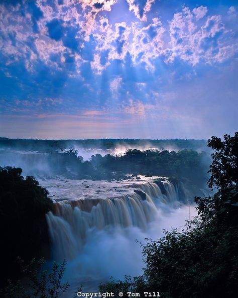 Cloud Rays at Iguazu Falls, Iguazu Falls National Park, Brazil   Huge waterfall in tropical rainforest of south Brazil Nature, Iguazu National Park, Bonito, Waterfall Pictures, Iguazu Falls, Les Cascades, Tropical Rainforest, Beautiful Waterfalls, Unesco World Heritage Site