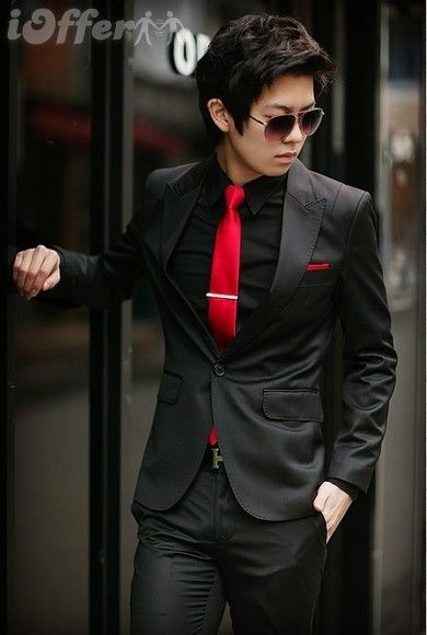 Tybalt would stand out in this classy yet catty suit. It puts a spin on the classic black tux by adding a splash of red for his sneaky intentions. Red And Black Wedding Suits Men, Black Tuxedo With Red Tie, Black Tux Red Vest, Black Suit White Shirt Red Tie, Black And Red Suits For Men, Red Black And White Suit Men, Black Suit Red Tie Aesthetic, Mens Black And Red Suit, Red Prom Tux Guys