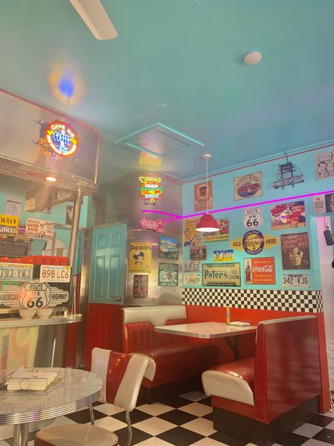 Retro diner aesthetic old fashioned 50s bright colours Diner Aesthetic Decor, 50s Cooking Aesthetic, 50s Cafe Aesthetic, Retro Dinner Exterior, 50s Neon Aesthetic, Retro Diner Poster, Blue Diner Aesthetic, Old Fashioned Diner Aesthetic, 50s Town Aesthetic