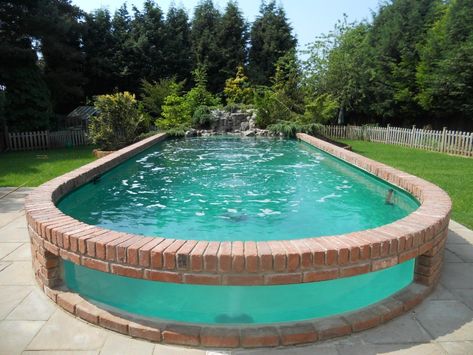 This is a very cool pool/waterfall setup. Something like this, with the neat underwater visibility, would probably be exceptionally cool in a koi pond. Piscina Diy, Oberirdischer Pool, Deck Piscina, Oberirdische Pools, Garden Swimming Pool, Diy Swimming Pool, Pool Waterfall, Above Ground Pool Decks, Above Ground Swimming Pools