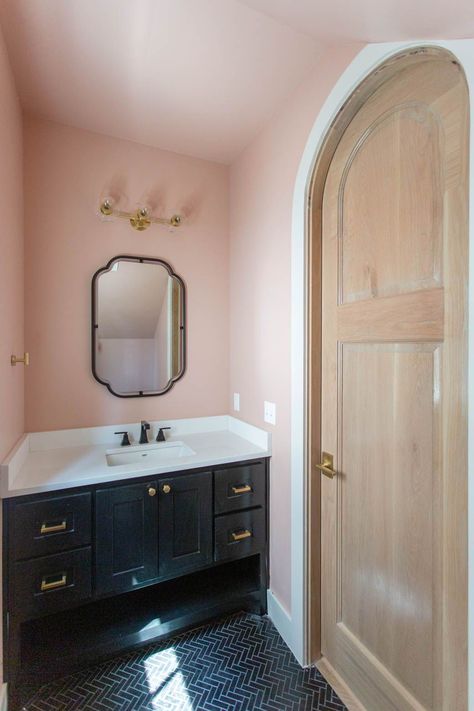 Blush pink powder bathroom with black vanity detail; herringbone black tile floors Black Floor Pink Walls, Pink Gold Black Bathroom, Black Pink And Gold Bathroom, Blush And Black Bathroom, Blush Pink And Black Bathroom, Pink Black And Gold Bathroom, Blush Pink Bathroom Ideas, Old Pink Bathroom, Black White And Pink Bathroom