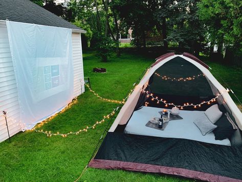 Set up a tent, white sheet, pillows + blankets, lights, and buy an inexpensive projector for an outdoor movie night! Backyard Movie Date Night Ideas, Outdoor Movie Date Night, Movie Date Night At Home Set Up, Tent Movie Night, Outdoor Movie Date, Movie Picnic, Movie Outdoor, Backyard Movie Screen, Diy Backyard Movie