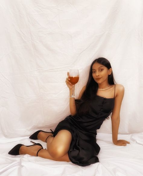 Silk Dress Photoshoot Studio, Poses In Satin Dress, Black Silk Dress Photoshoot, Glass Of Wine Photoshoot, Black Dress Shoot Ideas, Evening Gown Photoshoot Ideas, Black Gown Photoshoot Ideas, Wine Glass Photoshoot Photo Ideas, Photoshoot With Wine Glasses