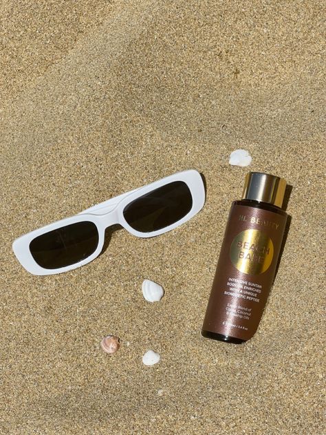 beach oil product photography ugc beach photo tanning oil tan tan lines aesthetic product photo Product Photography Beach Ideas, Product Beach Photoshoot, Tanning Oil Photography, Tanning Product Photography, Beach Skincare Aesthetic, Tan Product Photography, Beach Product Shoot, Sand Product Photography, Oil Photoshoot