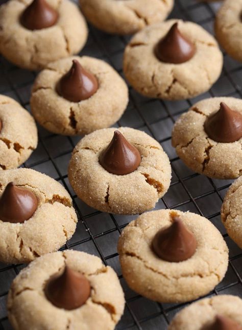 Soft peanut butter cookies with a warm Hershey's kiss in the center - these Peanut Butter Blossoms are a Christmas classic! And they're easy enough to enjoy year-round. #christmas #cookies #peanutbutterblossoms #cookierecipes #christmascookies #peanutbuttercookies #easycookierecipes #christmasrecipes Pb Kiss Cookies Peanut Blossoms, Pb Blossom Cookies, Pb Kiss Cookies, Christmas Cookies Peanut Butter, Chewy Christmas Cookies, Christmas Trays, Peanut Butter Blossoms Recipe, Pb Cookies, Peanut Butter Kiss