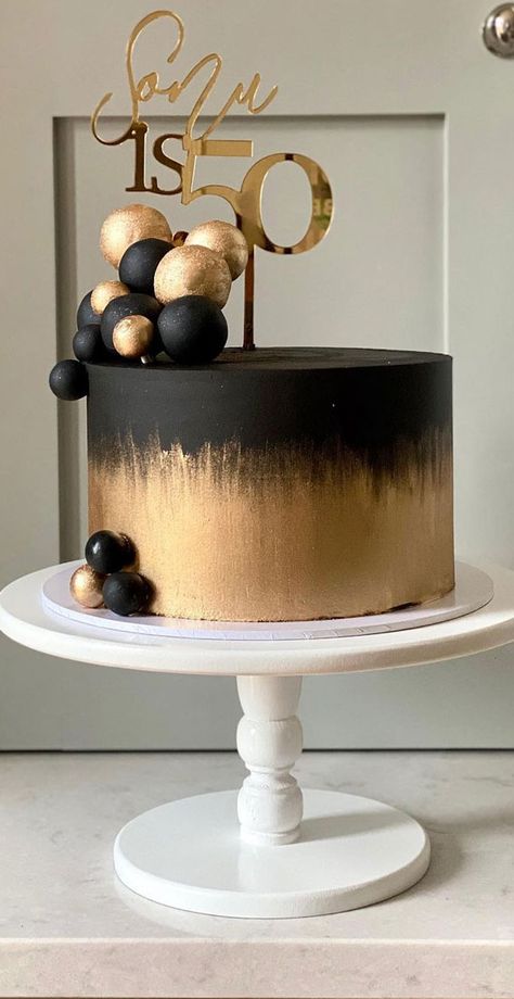 38. Black and gold Whether you’re looking for birthday cake ideas or celebration cakes.  We’ve got something for every occasion. The cake features matte... Black Gold Cakes Birthday, 50th Birthday Black And Gold Cake, Gold And Black 50th Birthday Cake, Black N Gold Cake For Men, Happy 50th Birthday Cake For Men, Black Gold White Cake Birthday, Cakes For Men 50th Birthday, 40th Birthday Cakes For Men Elegant, Cake In Black And Gold