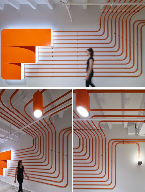 Studio BV have designed the Field Nation offices that were inspired by a circuit board and features orange conduit piping throughout, guiding people to the various areas of the office. #InteriorDesign #OfficeDesign #DesignAccent Google Office Interior Design, Funky Office Design, Pipes Design, Gray Interior Doors, Industrial Studio, Interior Design Office, Circuit Board Design, Industrial Office Design, Office Branding