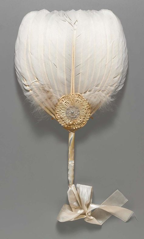 White feather fan with carved mother-of-pearl handle, white cloth rosette at base with shell blossom at center held in place with a metal grommet, white silk satin rib … Victorian Era, Antique Fans, Feather Fan, Vintage Fans, Hand Held Fan, White Feathers, Chatelaine, Historical Fashion, Hand Fan